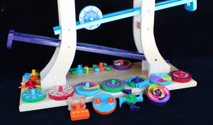 Rolling discs zig-zag down parallel tracks