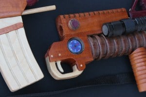 Forward end of wood weapon showing the compass and light