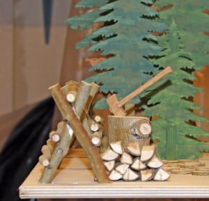 Trees, a fence, wood for the fireplace, part of the features in this wood plan package