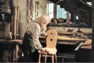 Grandfather building a chair for Heidi
