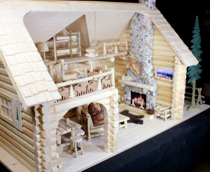 Color pages contain detail that can be cut out and added around the cabin