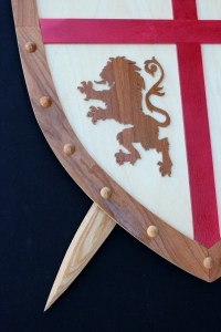 Sword and shield woodworking plan, tight view of lion insignia