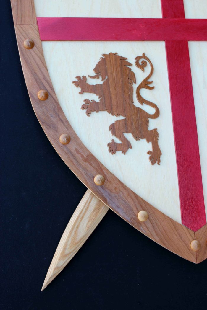 Sword and shield woodworking plan, tight view of lion insignia