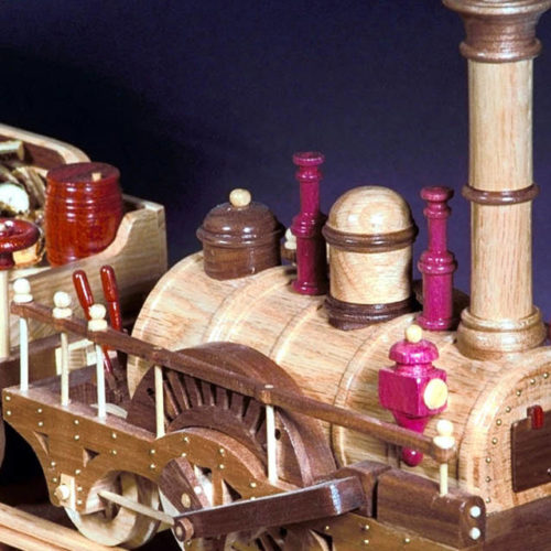 Wood train from the 1800's, three cars, track system