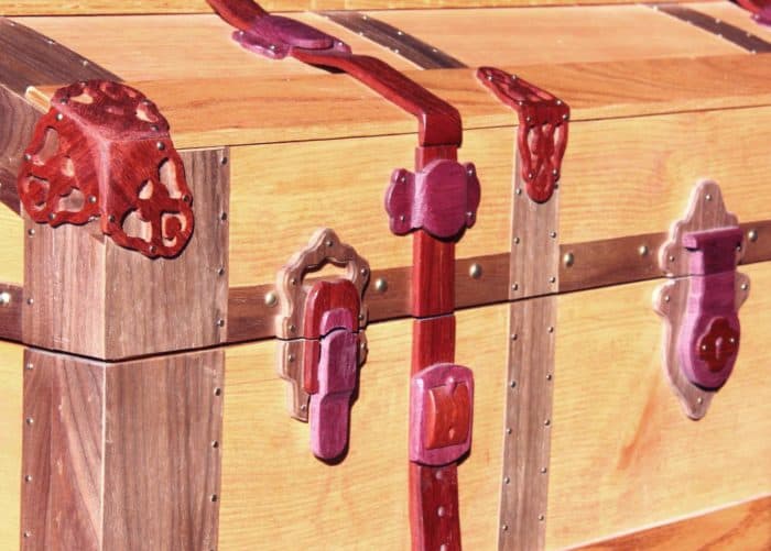 Assorted hardwoods to represent leather straps and brackets on the trunk