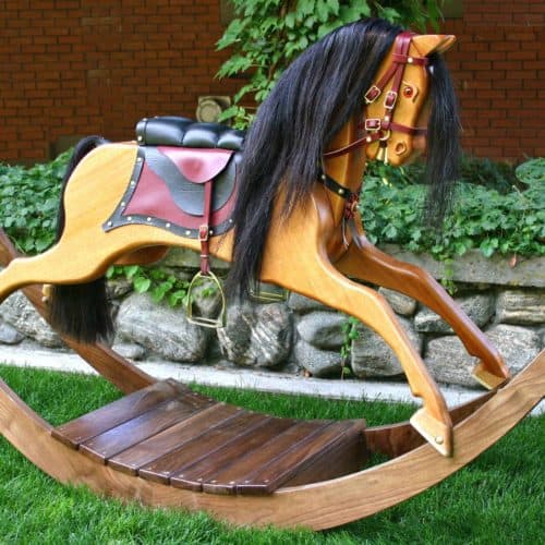 Victorian Rocking Horse in Walnut and Mahogany and uses real horse hair