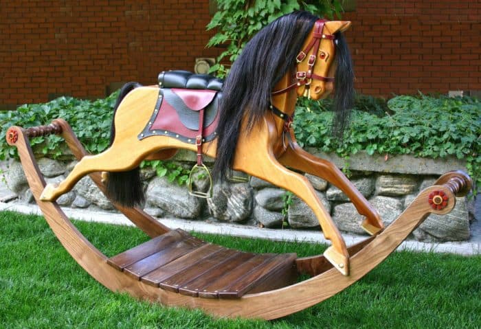 Victorian Rocking Horse in Walnut and Mahogany and uses real horse hair