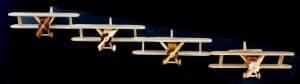 Four bi-wing planes in flight, part of a woodworking plan package