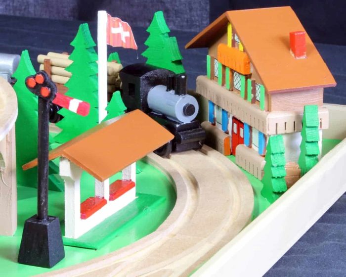 View of one secton of a large, nearly all wood train and track play set