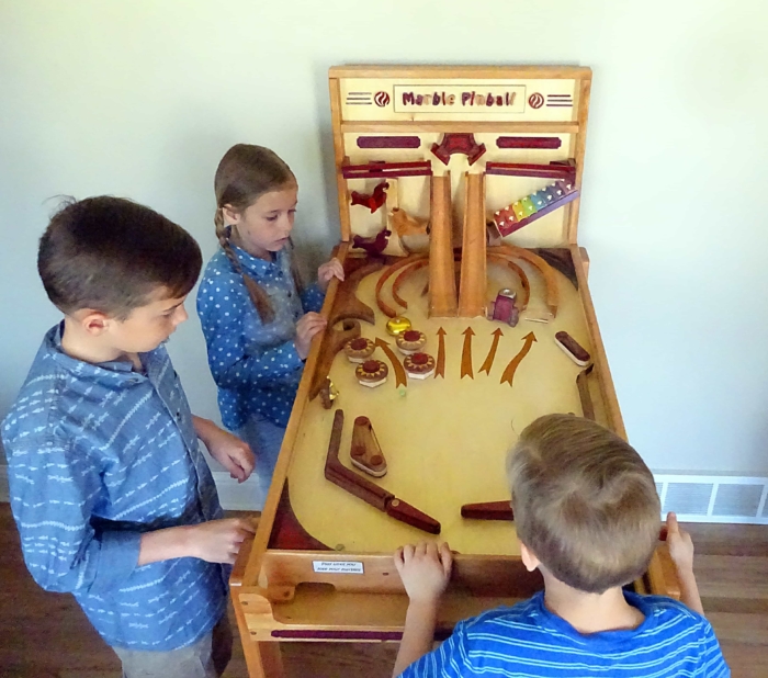 Youngsters playing the popular Marble Pinball Machine